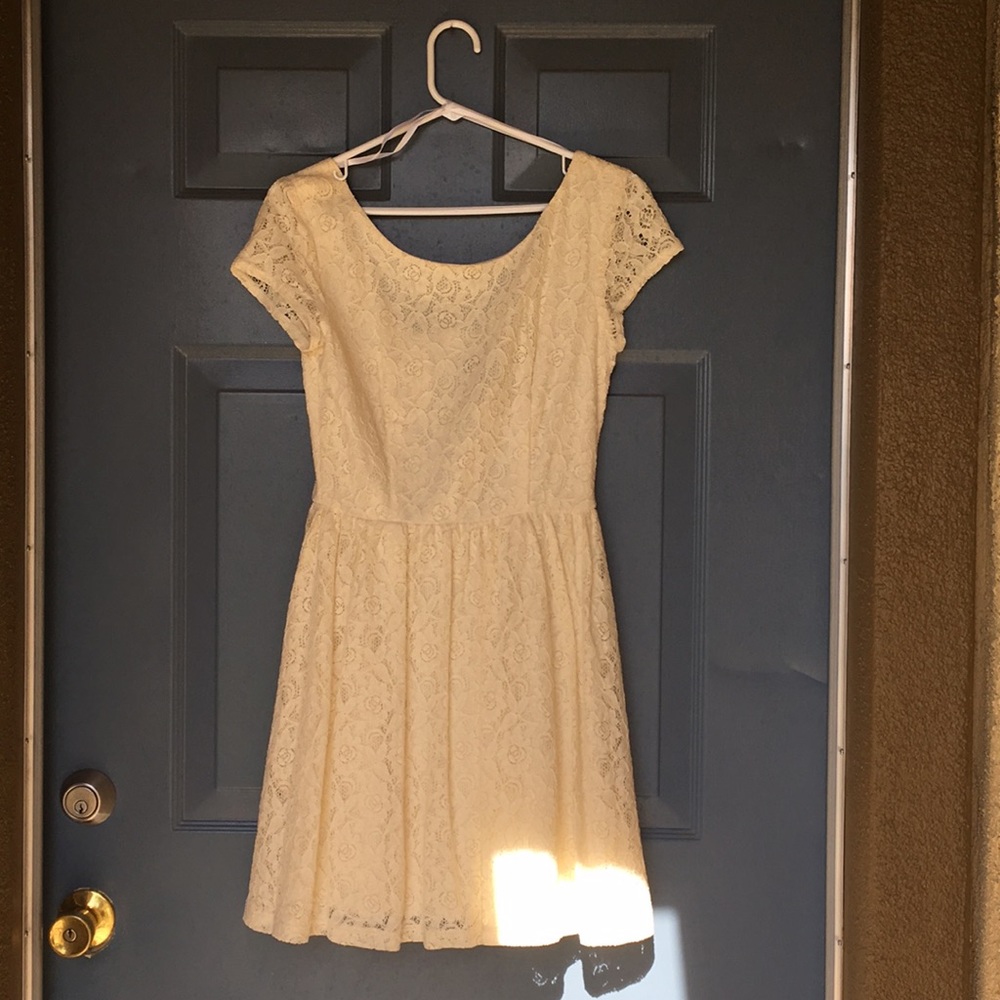A creamy white float dress, create for any day